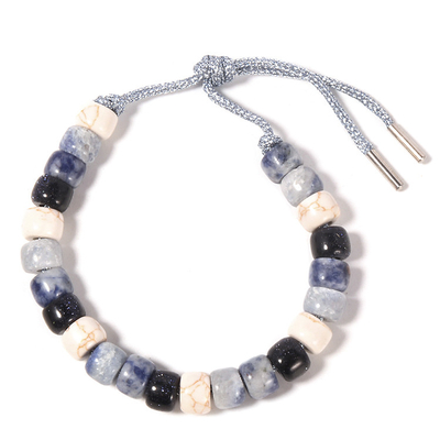 Содалит Howlite отбортовал браслет 13.5g с заплетенным серебряным шнуром